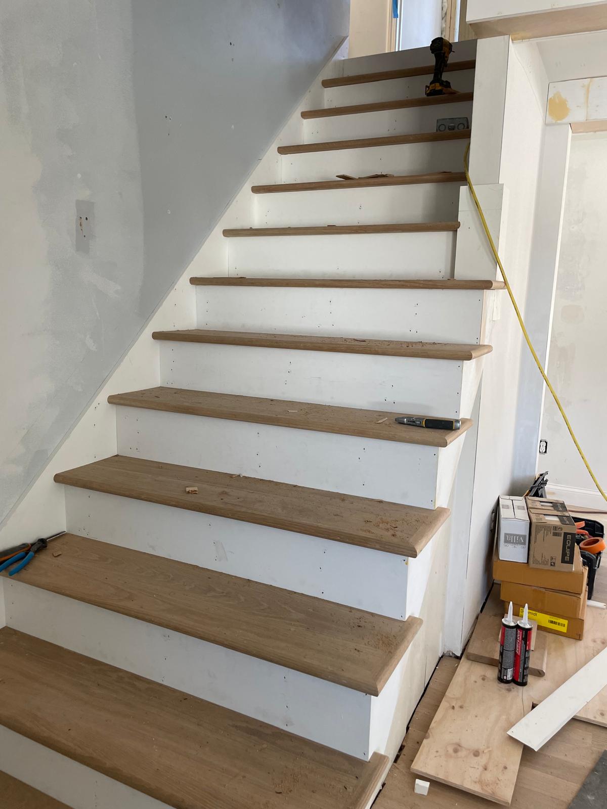 Photo of a staircase with high-quality wood flooring installed by Victor's Finish Work