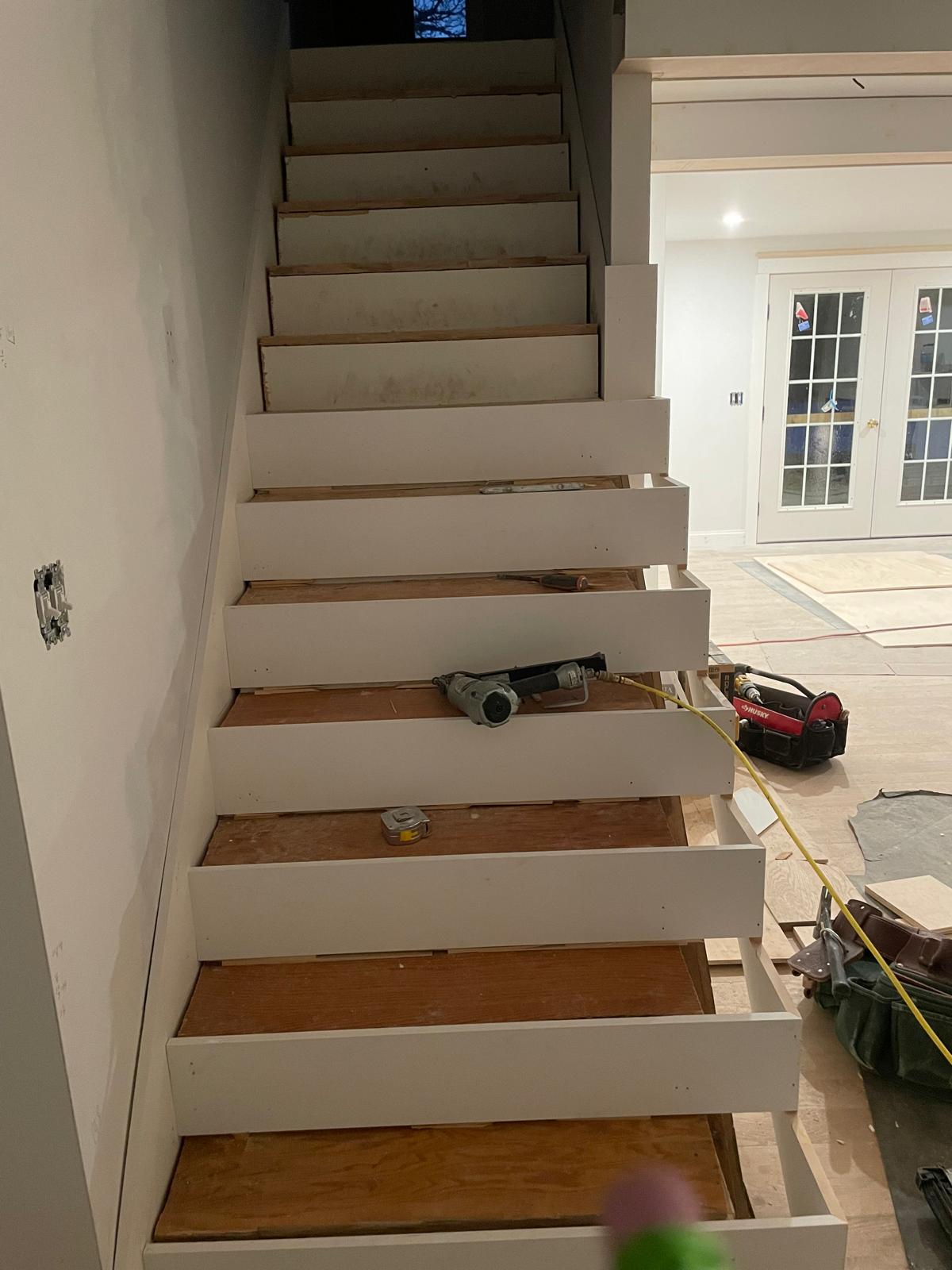 Photo of a staircase with high-quality wood flooring installed by Victor's Finish Work