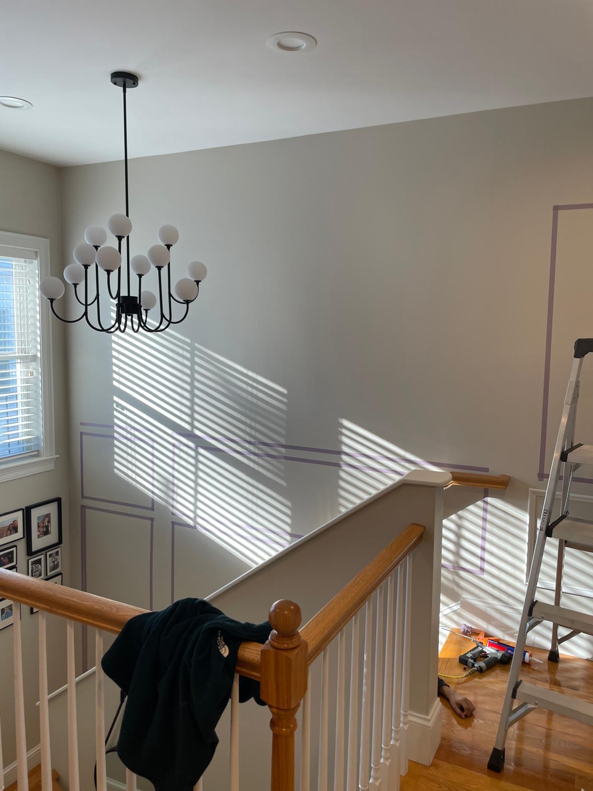 Before and after photo of decorative drywall grid pattern on wall by Victor's Finish Work